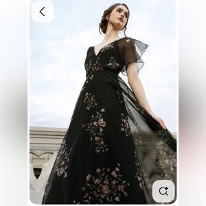 Jenny Yoo Cassie
Flutter Sleeve
Surplice Gown
Black with Floral Pattern.